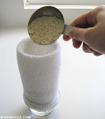 Pouring the rice into the sock to make the rice sock warm compress